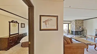 a living room with a couch and a fireplace at Comfortable Cozy 2 Bedroom Condo with Loft! in Mammoth Lakes