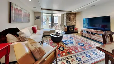 a living room with a couch and a tv at Beautiful 2 Bedroom Condo with Amazing View! in Mammoth Lakes