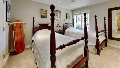 a bedroom with two beds with white sheets at Beautiful 2 Bedroom Condo with Amazing View! in Mammoth Lakes