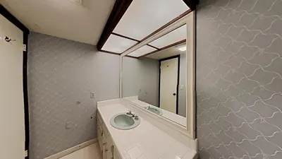 a bathroom with a sink and a mirror at Retro 3 Bed 3 Bath Condo with Mountain View! in Mammoth Lakes