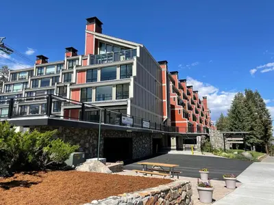 a large building with a bench in front of it at Lakeview 826 Condo #532 Condo in Mammoth Lakes