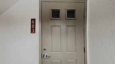 a white door with two pictures on top of it at Cozy 4-Bedroom Home with Pool and Mountain View! in Mammoth Lakes