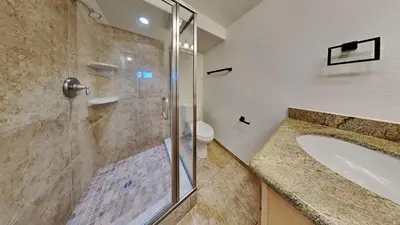 a bathroom with a shower and a sink at Large Spacious Upgraded 4 Bedroom Condo in Mammoth Lakes