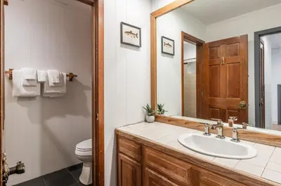 a bathroom with a sink and a toilet at Canyon Ski and Racquet 16 in Mammoth Lakes
