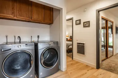 a laundry room with a washer and dryer at Canyon Ski and Racquet 16 in Mammoth Lakes