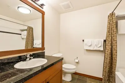 a bathroom with a sink and a toilet at Village 3311 in Mammoth Lakes