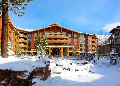 a large building with snow in front of it at Village 3311 in Mammoth Lakes