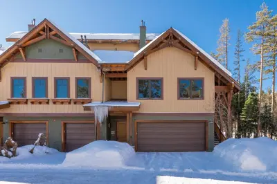 a house with snow on the ground at Woodwinds 25 in Mammoth Lakes