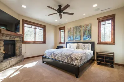 a bedroom with a bed and a fireplace at Gray Bear 514 in Mammoth Lakes