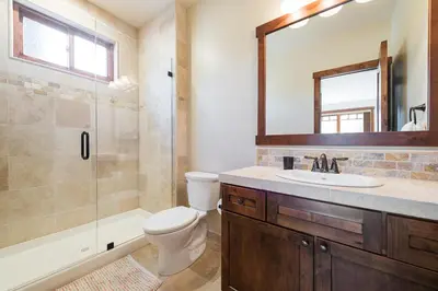 a bathroom with a toilet and a sink and a shower at Gray Bear 514 in Mammoth Lakes