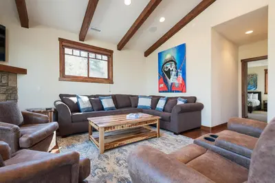 a living room with couches and a coffee table at Gray Bear 514 in Mammoth Lakes