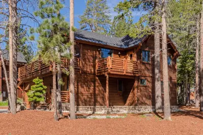 a log cabin in the woods with trees at Gray Bear 514 in Mammoth Lakes