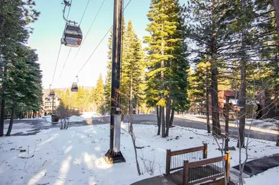 a park with two benches and a ski lift at Northstar - Ski Trail Condo in Kingswood Estates