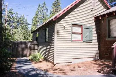 a small house with a window and a fence at North Shore - Dancing Antler in Wood Vista