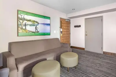a living room with a couch and a painting on the wall at Hilton Vacation Club Tahoe Seasons Lake Tahoe in South Lake Tahoe