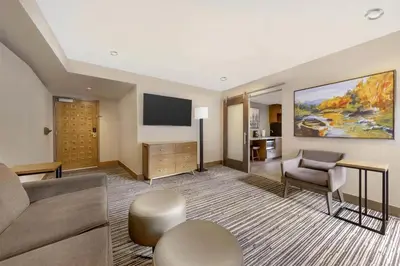 a living room with a couch and a tv at Hilton Vacation Club Tahoe Seasons Lake Tahoe in South Lake Tahoe