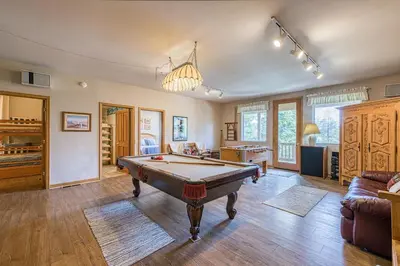 a living room with a pool table in it at White Pines Mountain Lodge #7 in Mammoth Lakes