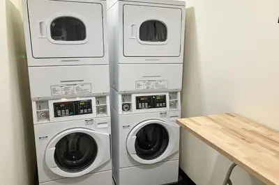 three washer and dryer machines in a room at Discovery 4 119 in Mammoth Lakes