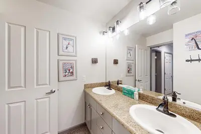 a bathroom with two sinks and a mirror at Eagle Run 206 in Mammoth Lakes