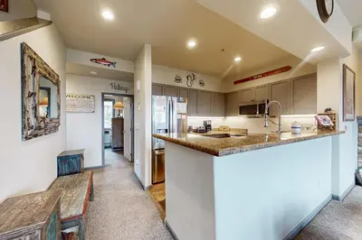 a kitchen with a sink and a counter top at Eagle Run 206 in Mammoth Lakes