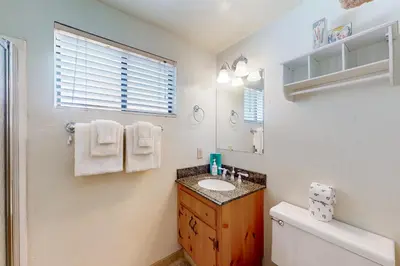 a bathroom with a sink and a mirror at Mammoth View Villas 30 in Mammoth Lakes