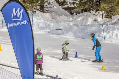 a group of people on skis in the snow at The Summit 67 in Old Mammoth