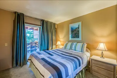 a bedroom with a bed and a window at The Bridges 23 in Mammoth Lakes