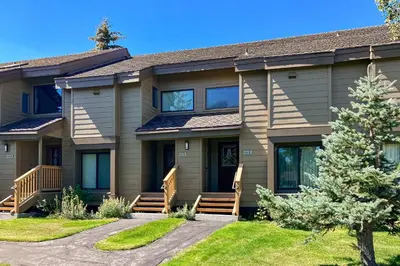 a house with a pathway in front of it at Snowcreek 233 in Mammoth Lakes