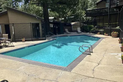 a swimming pool with a hose in a yard at Timberline 35 in Mammoth Lakes