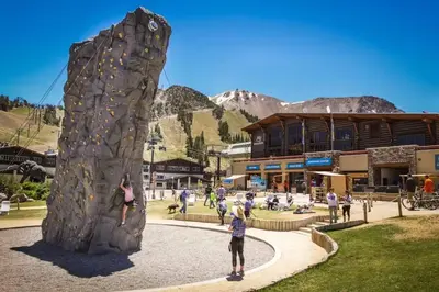 a group of people playing on a rock wall at Val D'Isere 26 in Mammoth Lakes
