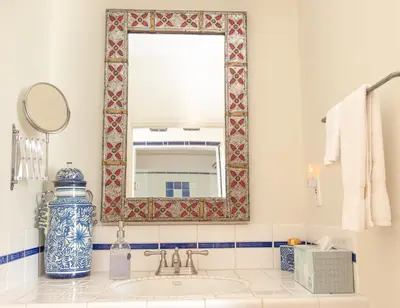 a bathroom with a sink and a mirror at Posada Mariana Bed and Breakfast in Catheys Valley