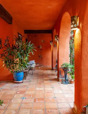 an empty hallway with plants in a building at Posada Mariana Bed and Breakfast in Catheys Valley