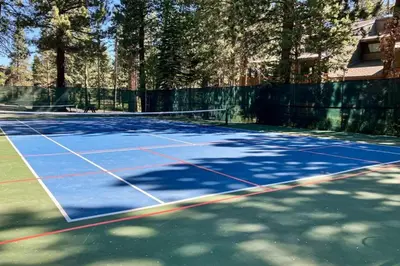 a tennis court with a net on it at The Summit 207 in Old Mammoth