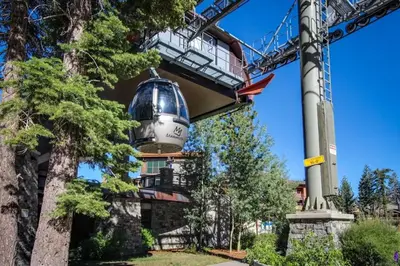 a building with a bell hanging from a crane at The Summit 207 in Old Mammoth
