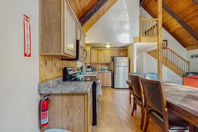 a kitchen with wooden cabinets and a counter top at Charming Tahoe Chalet in Tahoe Valley