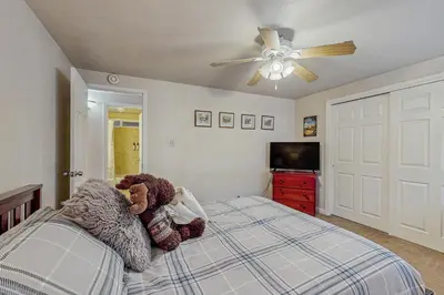 a bedroom with a bed with teddy bears on it at Charming Tahoe Chalet in Tahoe Valley