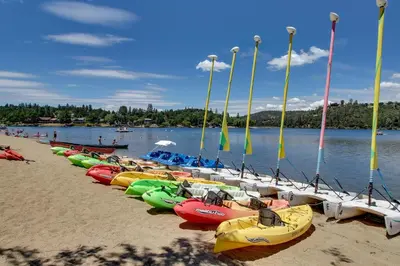 a row of kayaks lined up on a beach at Mule Deer Cabin (4-538) in Groveland