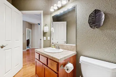 a bathroom with a sink and a mirror at Mule Deer Cabin (4-538) in Groveland
