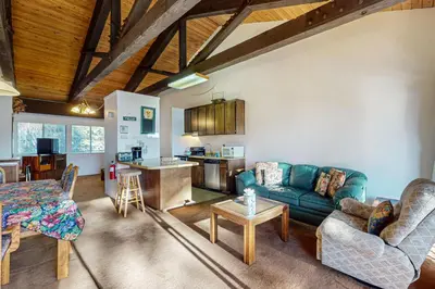 a living room with a couch and a table at Dollar Hill 2 Dreamcatcher in Dollar Point