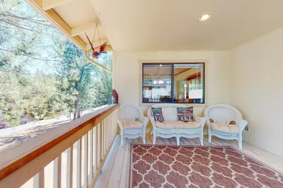 a porch with chairs and a large window at Owl's Lookout (05/061) in Groveland
