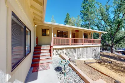 a house with a porch and stairs on it at Owl's Lookout (05/061) in Groveland