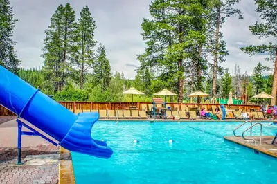 a slide in a swimming pool at a resort at Jade House in Truckee