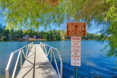 a bridge over a body of water with two signs at Forest Treasure (01/497) in Groveland