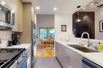 a kitchen with a sink and a stove top oven at Squaw Valley Ski Flat in Olympic Valley