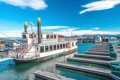 a ferry boat docked at a dock in the water at Squaw Valley Ski Flat in Olympic Valley