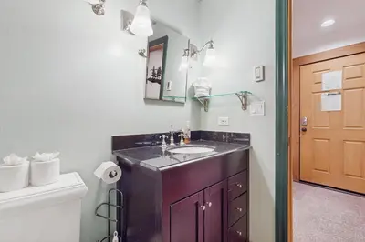 a bathroom with a sink and a toilet at Aspen Grove Studio at Northstar in Truckee