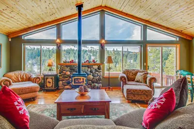 a living room with a couch and a fireplace at Hillside View Vacation Home in Truckee
