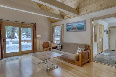 a living room with a couch and a table at Snowpeak Chalet in Tahoe Donner in Truckee