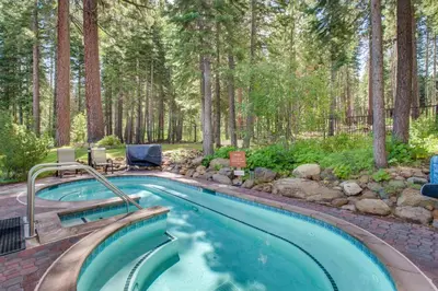 a swimming pool in the middle of a forest at Northstar Original Village Studio One in Truckee