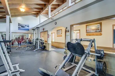 a gym with several treadmills and weights at Northstar Original Village Studio One in Truckee